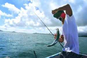 Man holding fish fun fishing tour