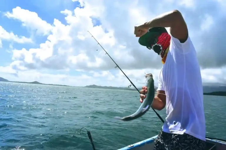 Man holding fish fun fishing tour