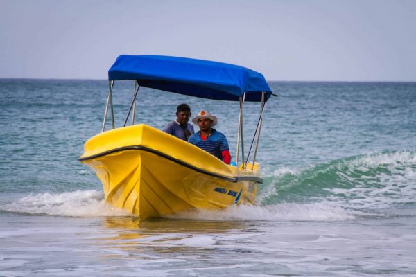 yellow boat with boatmen