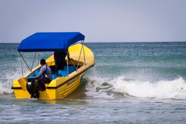 yellow boat on the ocean waves
